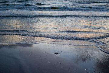 Evening seascape with clouds and waves.