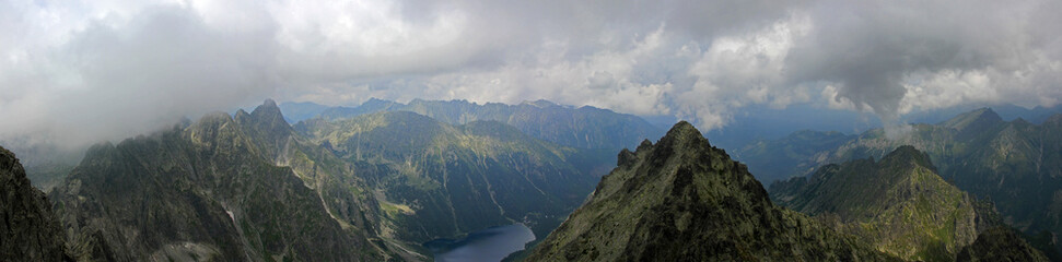 Mountain lakes of Czarny Staw pod Rysami and Morskie Oko seen from Poland's highest point, the north-western summit of Rysy, 2,499 metres (8,199 ft) in elevation. - obrazy, fototapety, plakaty