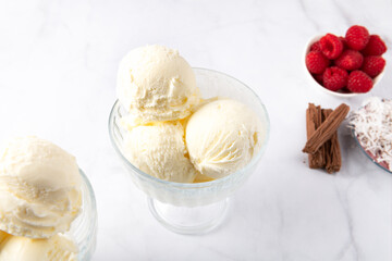 Vanilla Ice Cream Scoops with raspberries and chocolate sticks, easy dessert at home