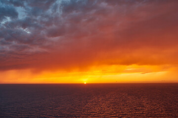 Dramatic sunset over the Mediterranean.  Distant rain