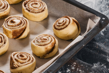 Cooking handmade buns with cinnamon
