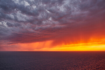 Dramatic sunset over the Mediterranean.  Distant rain