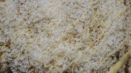 Macro closeup texture of shredded coconut and white chocolate