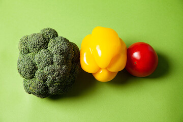 Ripe fresh bell pepper and tomato arranged with green broccoli