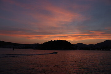 sunset on the sea and going boat