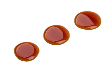 Syrup drops, isolated on white background. High resolution image