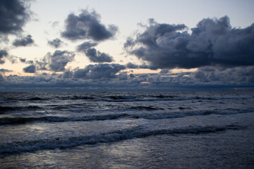 Evening seascape with clouds and waves.