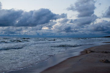 Evening seascape with clouds and waves.