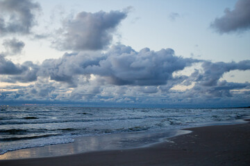 Evening seascape with clouds and waves.