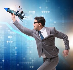 Businessman on rocket in trading concept
