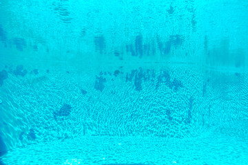 Inside the very clean and turquoise color swimming pool