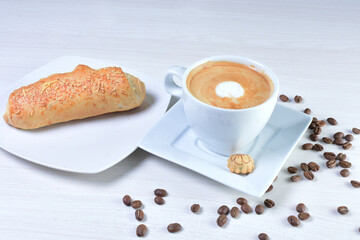 Cup of colombian coffee, decorated on white wooden background