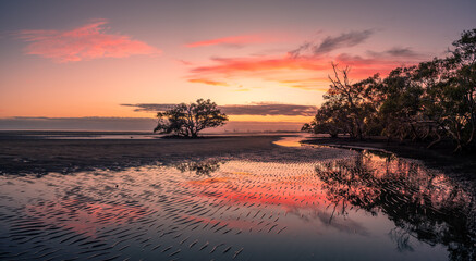 Panoramic Seaside Sunrise with Cloud Reflections