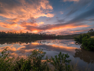 Riverside Sunrise with Beautiful Cloud Reflections