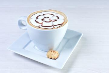 Cup of colombian coffee, decorated on white wooden background