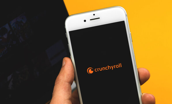 Kharkov, Ukraine - February 22, 2021: Crunchyroll logotype close up, application on Apple smartphone