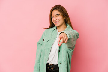 Young skinny caucasian teenager girl pointing to front with fingers.