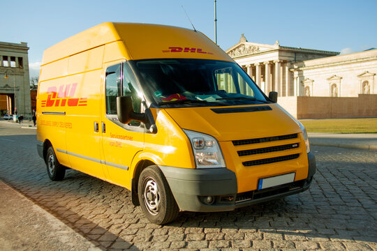 DHL Truck delivering packages in Munich Germany to ensure xpress deliveries and parcel shipments arrive on time