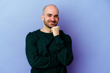 Young caucasian bald man isolated on purple background smiling happy and confident, touching chin...