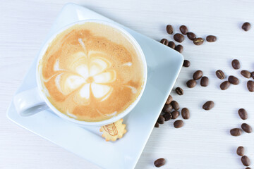 Cup of colombian coffee, decorated on white wooden background