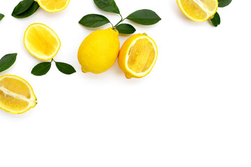 Fresh lemon with green leaves on white.