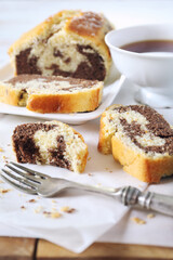 Homemade traditional marble cake and cup of black tea