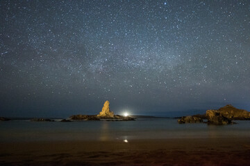 Spain, Menorca, Pregonda. Night sky at the beach.