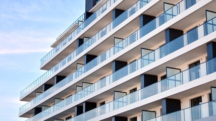 Fototapeta premium Condominium and apartment building with symmetrical modern architecture in the city downtown.