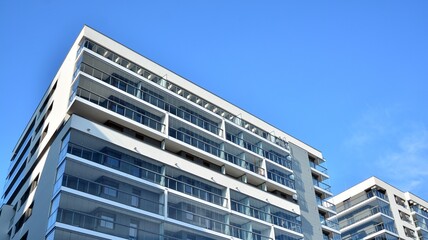 Condominium and apartment building with  symmetrical modern architecture in the city downtown.