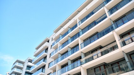 Condominium and apartment building with  symmetrical modern architecture in the city downtown.