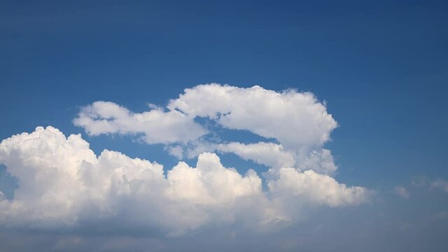 Building motions clouds. Puffy fluffy white clouds sky time lapse. slow moving clouds. footage timelapse nature 4k. background
