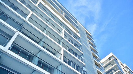 Condominium and apartment building with  symmetrical modern architecture in the city downtown.