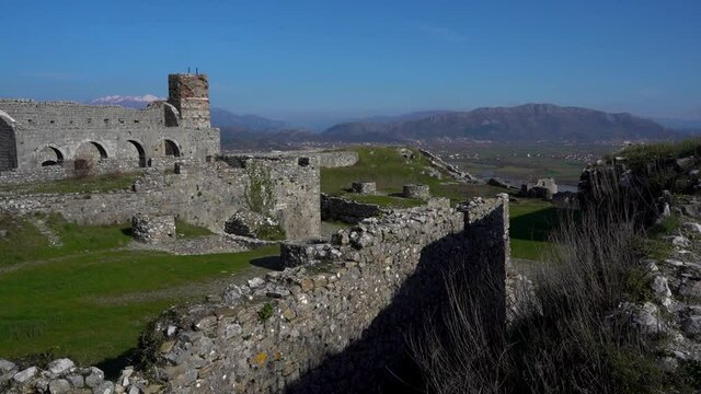 Ancient stone walls of Rozafa castle and ruined buildings inside the fortress
