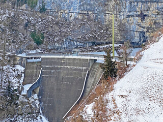 Dam of a small accumulation lake in the canyon of the Fallenbach alpine stream above Lake Walen...