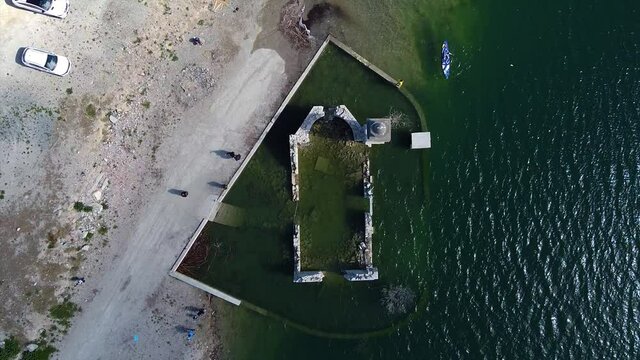 Top-down aerial view of the famous underwater St. Nicolas Church inside the Kourris Dam, Cyprus.