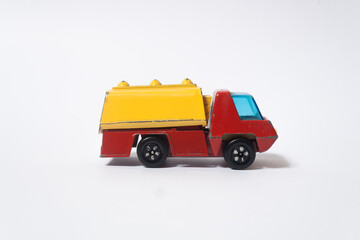 old red and yellow children's toy car, side view