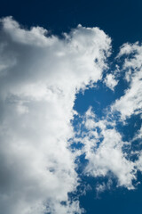 white clouds royal blue background