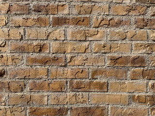 Background of overlapping brown bricks in various shades