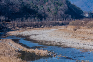 Dry rocky riverbed in rural countryside