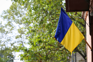 National flag of Ukraine on wall outdoors