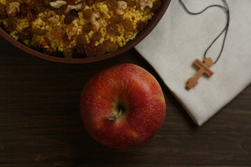 Flat lay composition with Great Lent dinner and crucifix on wooden table