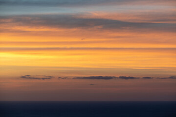 Naklejka na ściany i meble View of sunset clouds over Tasman sea