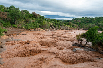 Rapid dirty river in Tanzania Africa