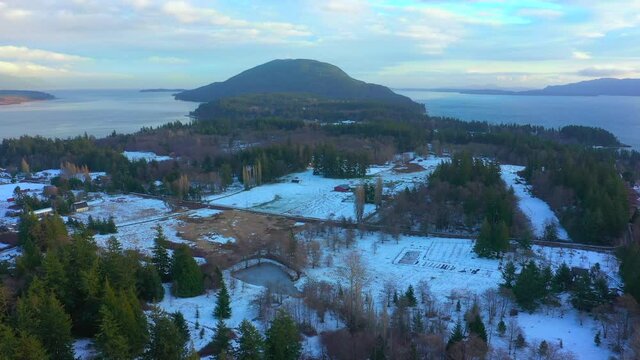 Snowy Island Sunset in the Pacific Northwest. Aerial view of Lummi Island where snowfall is infrequent yet beautiful nonetheless. Lummi Island is situated in the Salish Sea just outside of Bellingham.