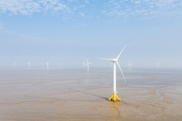 wind farm on coastal mudflat wetland