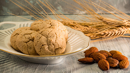 Bitter Almond Cookie as known as almond macaron with almond and spike, food photography concept