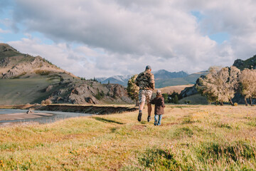Fototapeta premium father and son running on the country road