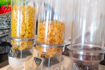Fototapeta na wymiar Different kind of cereal corn flakes on self service breakfast.
