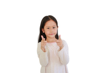 Cute Asian little child girl child pointing at you and looking camera isolated on blue background. Kid point two index fingers to front