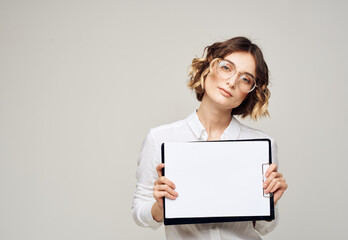 Fototapeta premium Woman on light background with document folder white shirt glasses mockup
